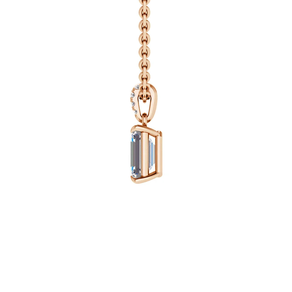 A gold chain with a rectangular aquamarine pendant, set vertically, on a plain white background.