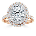 Rose gold ring with an oval diamond center, double halo, and diamond-studded band, all on a white background.