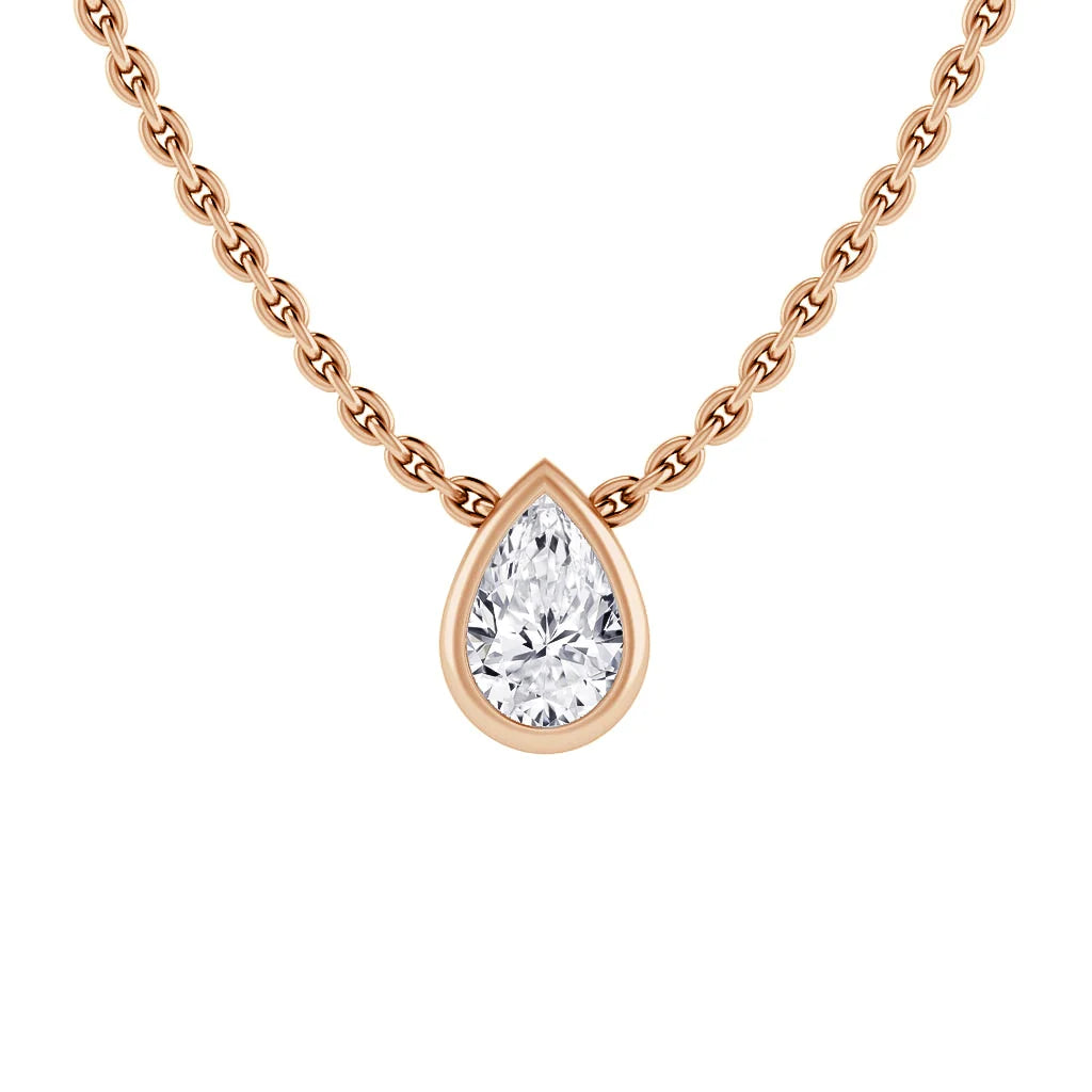 Rose gold chain necklace with a pear-shaped diamond pendant in a matching rose gold bezel setting.