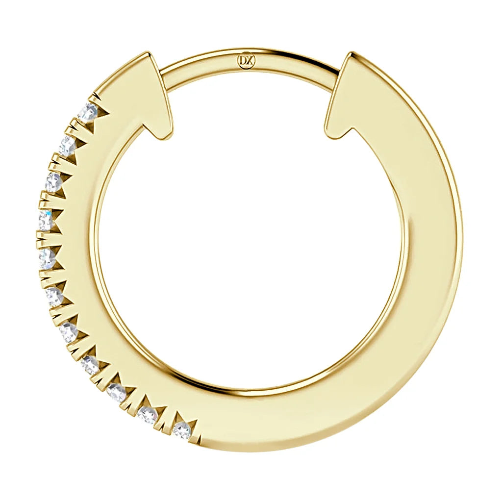 Gold hoop earring with one side set with small white gemstones, shown against a white background.