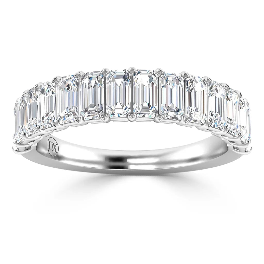 Platinum band with a row of emerald-cut diamonds set across the top, creating a sparkling, elegant ring.