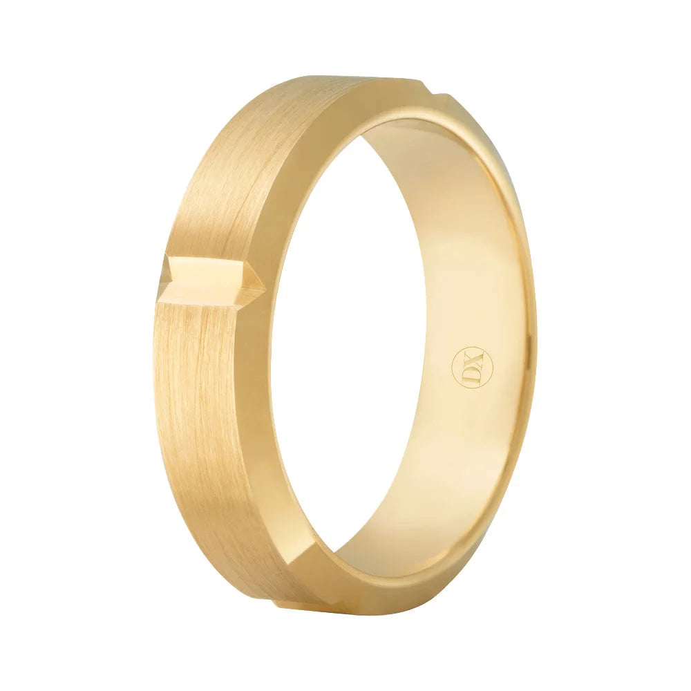 A matte gold ring with a geometric notch design on its outer edge, shown against a white background.