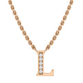 Gold chain necklace with a capital letter L pendant, decorated with small round diamonds on one side.