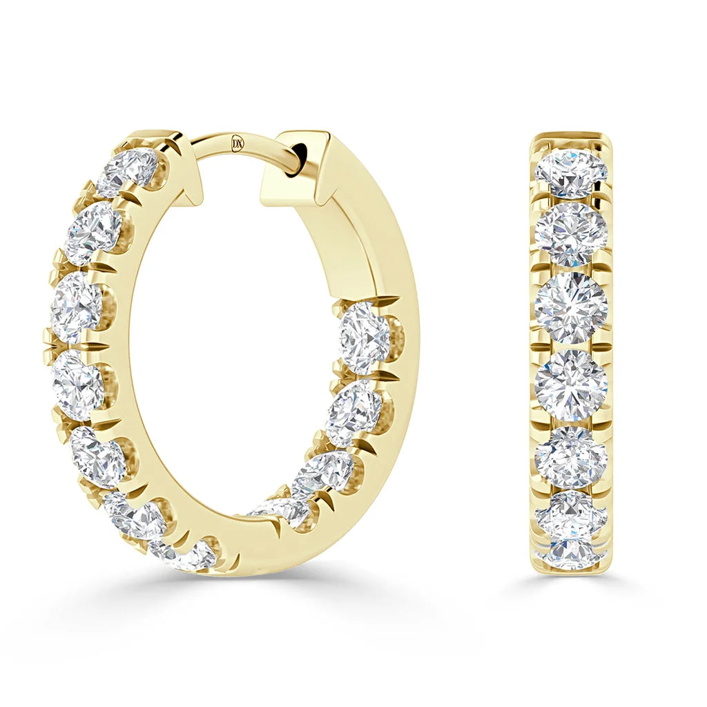 Gold hoop earrings with inset round diamonds, shown from angled and front views on a white background.
