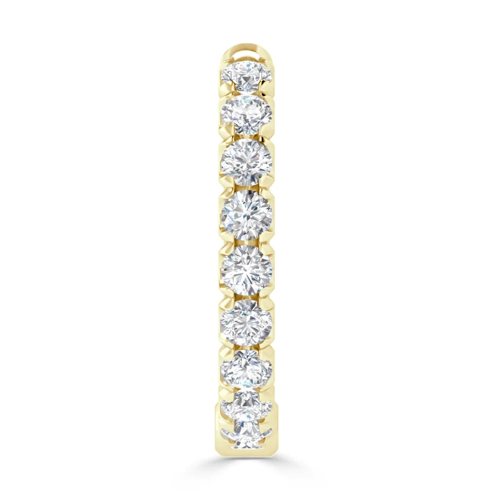 A vertical gold bar pendant set with seven sparkling round diamonds in a row on a white background.