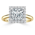 Gold ring with a large square diamond center, surrounded by two rows of small round diamonds in a halo setting.
