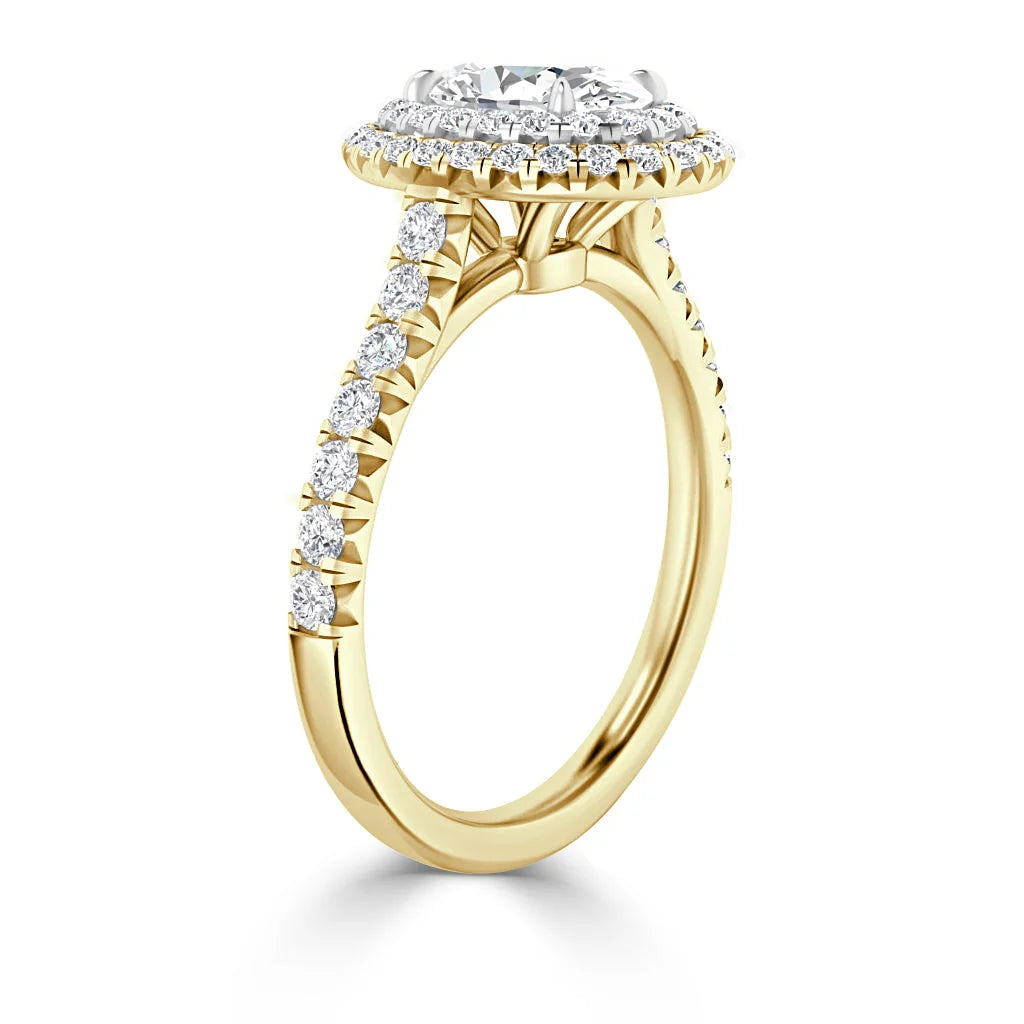 Yellow gold ring with round-cut diamonds along the band and a large central halo diamond setting.