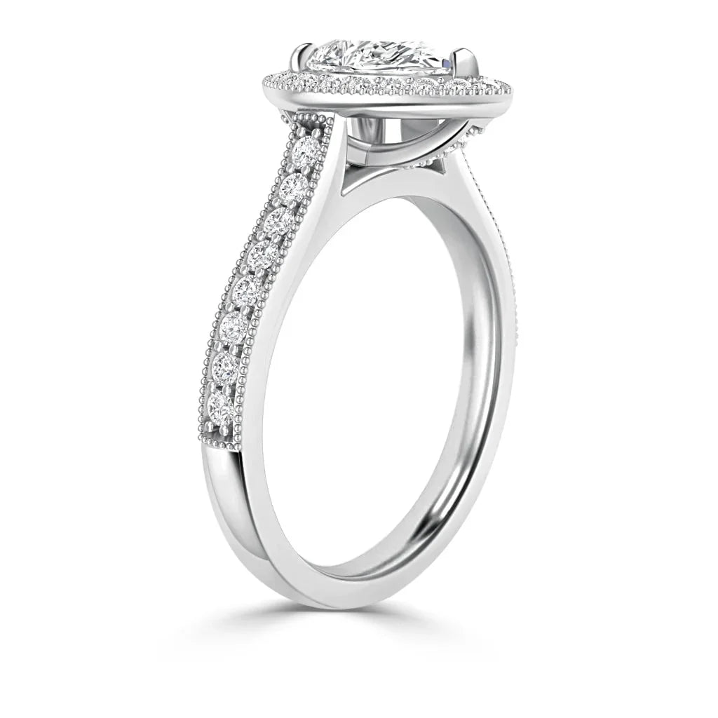 Side view of a white gold ring with pavé diamonds on the band and a large oval center stone in a halo setting.