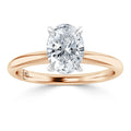 Oval diamond solitaire ring with a rose gold band and four prongs, viewed from the front.