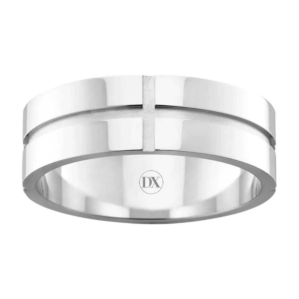 A silver band ring with a recessed cross design and DX engraved inside the band.