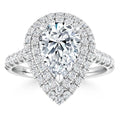 Pear-shaped diamond ring with double halo and split-shank band, all set with small round diamonds.