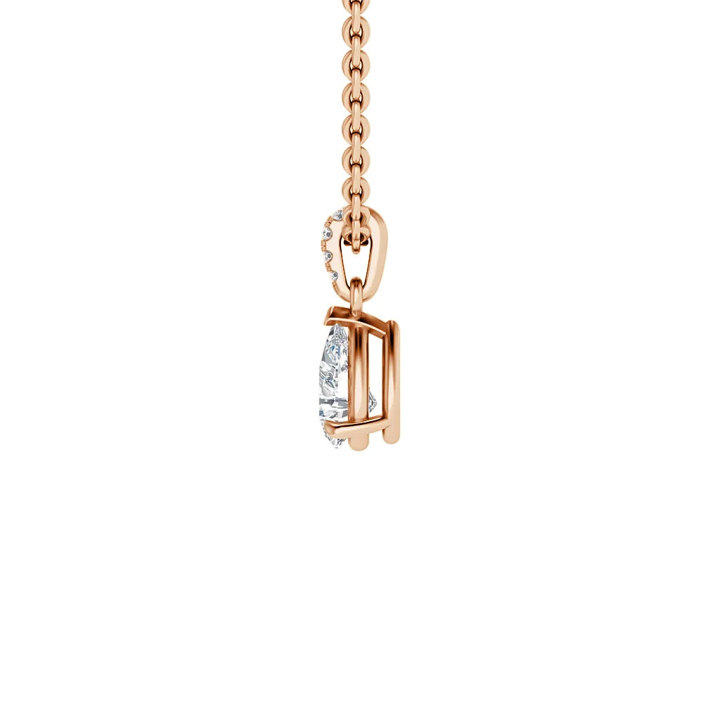 Side view of a rose gold necklace with a suspended oval diamond pendant on a white background.