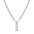 Silver necklace with a pendant shaped like the letter I, adorned with a row of small, sparkling diamonds.
