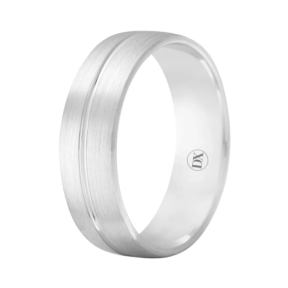 A brushed silver band ring with a subtle groove and a small “DY” engraved inside.