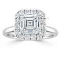 White gold ring with a square emerald-cut diamond center, surrounded by a halo of round diamonds.