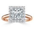 Rose gold ring with a large square diamond center, surrounded by two rows of small round diamonds.