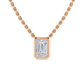 A gold chain necklace with a rectangular emerald-cut diamond pendant in a gold bezel setting.