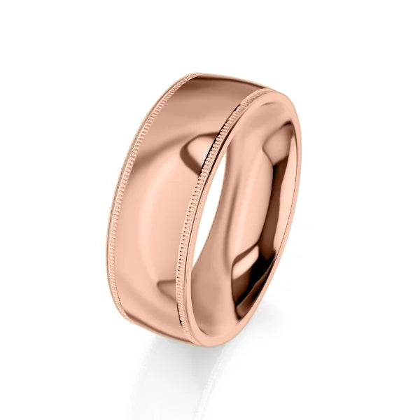 A polished rose gold band ring with subtle milgrain edges, set against a white background.