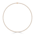 The Mikayla necklace by DX Diamonds features an 18ct rose gold chain with small, sparkling diamonds in a circular design, ideal for special occasions. Displayed on a white background.