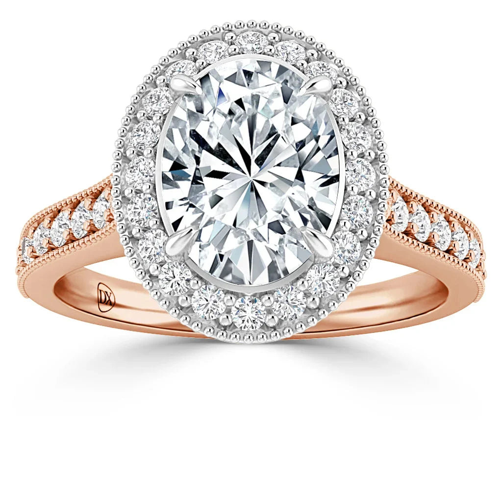 Oval diamond halo engagement ring with rose gold band and smaller diamonds around the center stone.