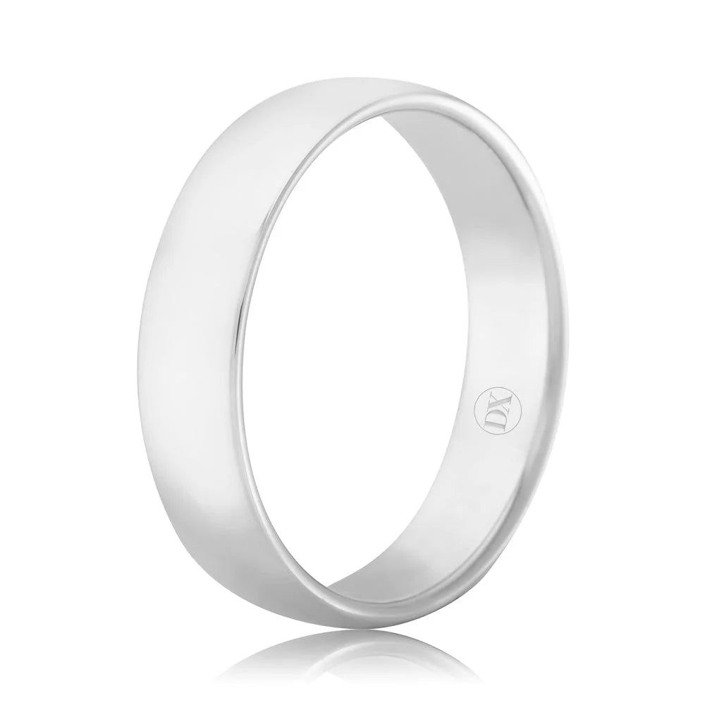 A plain, polished silver ring with a smooth surface and a small engraved emblem on the inner band.