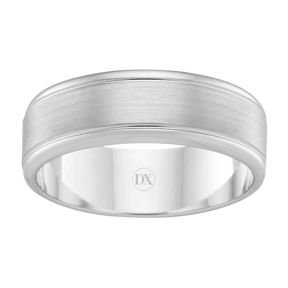 A silver brushed metal ring with polished edges and DX engraved inside the band.