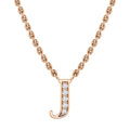 Rose gold chain necklace with a pendant shaped like the letter J, adorned with small white gemstones.