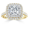 Gold ring with a large square diamond and two rows of smaller diamonds on the band and around the center stone.