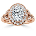 Rose gold ring with an oval center diamond, halo of smaller diamonds, and intricate side detailing.