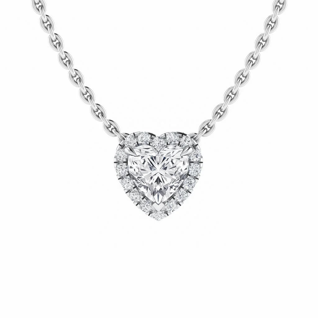 Heart-shaped diamond pendant with a halo of smaller diamonds on a silver chain, set against a white background.