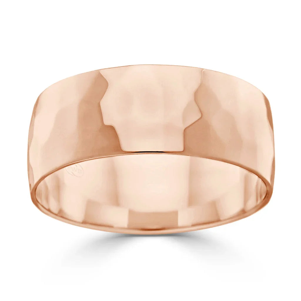 Wide rose gold band ring with a hammered, faceted texture and a reflective, polished finish.