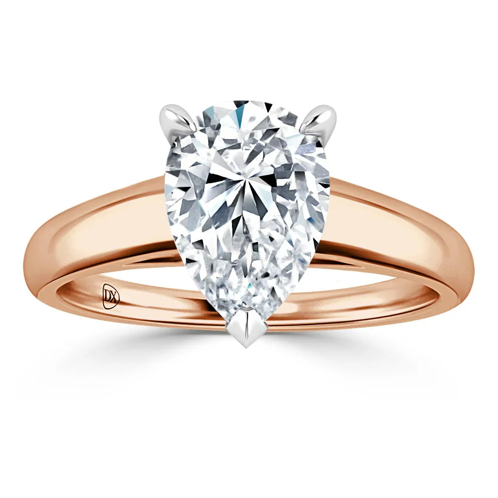 A pear-shaped diamond solitaire ring with a rose gold band, shown against a white background.