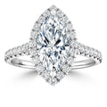 Marquise-cut diamond ring with a halo and band encrusted with small round diamonds on a white background.