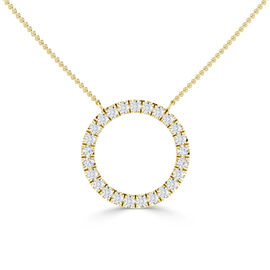 Gold necklace with an open circle pendant encrusted with small round diamonds, on a fine chain, white background.