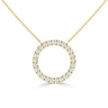 Gold necklace with an open circle pendant encrusted with small round diamonds, on a fine chain, white background.