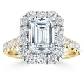Emerald-cut diamond ring with round diamond halo and gold band, set against a white background.
