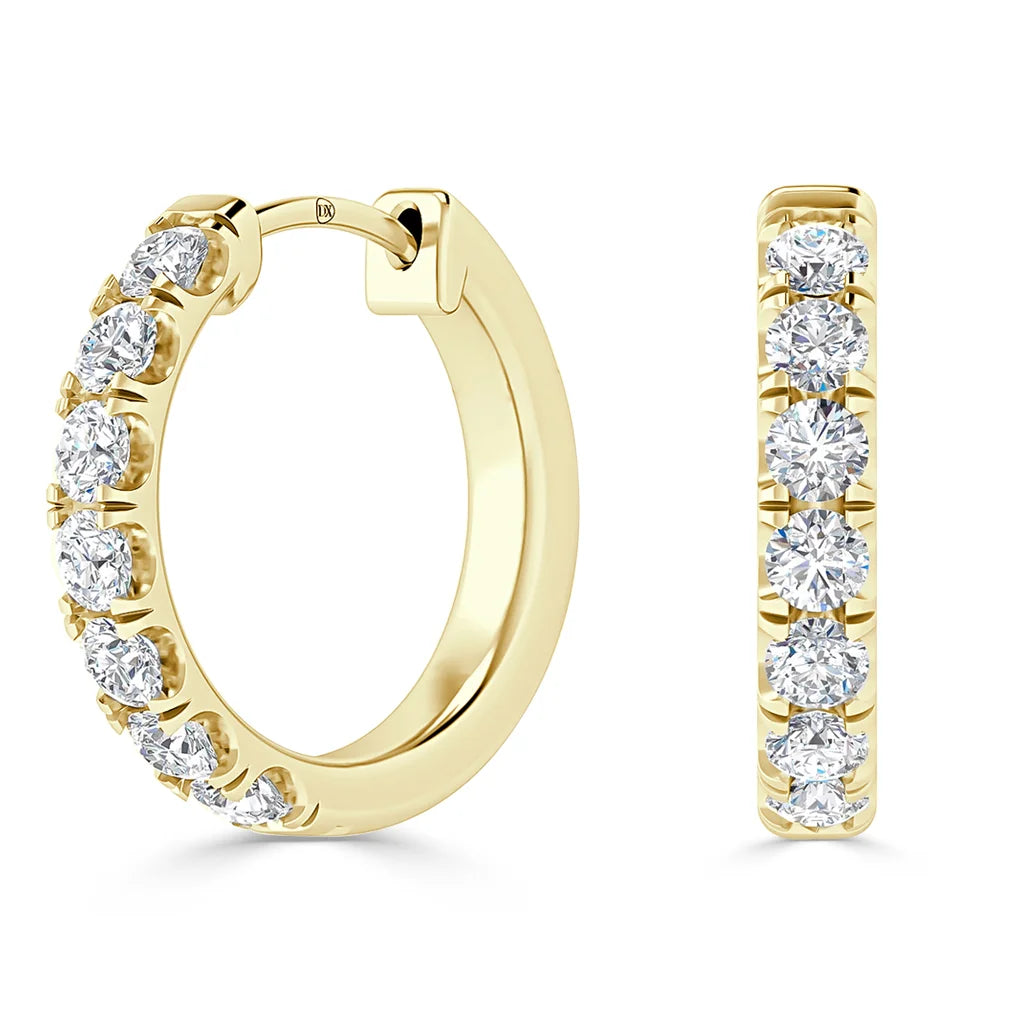 Gold hoop earrings with seven round-cut diamonds set along the front, shown from side and front views.