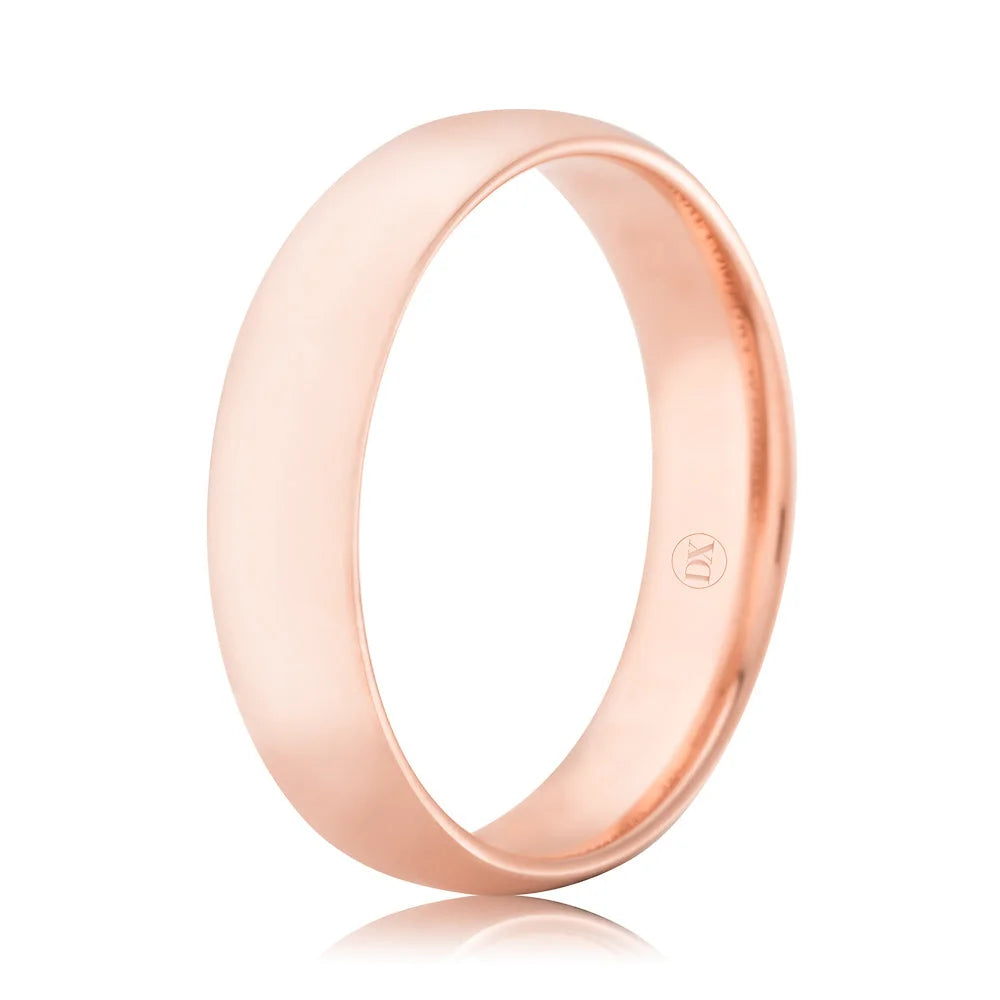 A simple, polished rose gold ring with a smooth surface and a slightly rounded band.