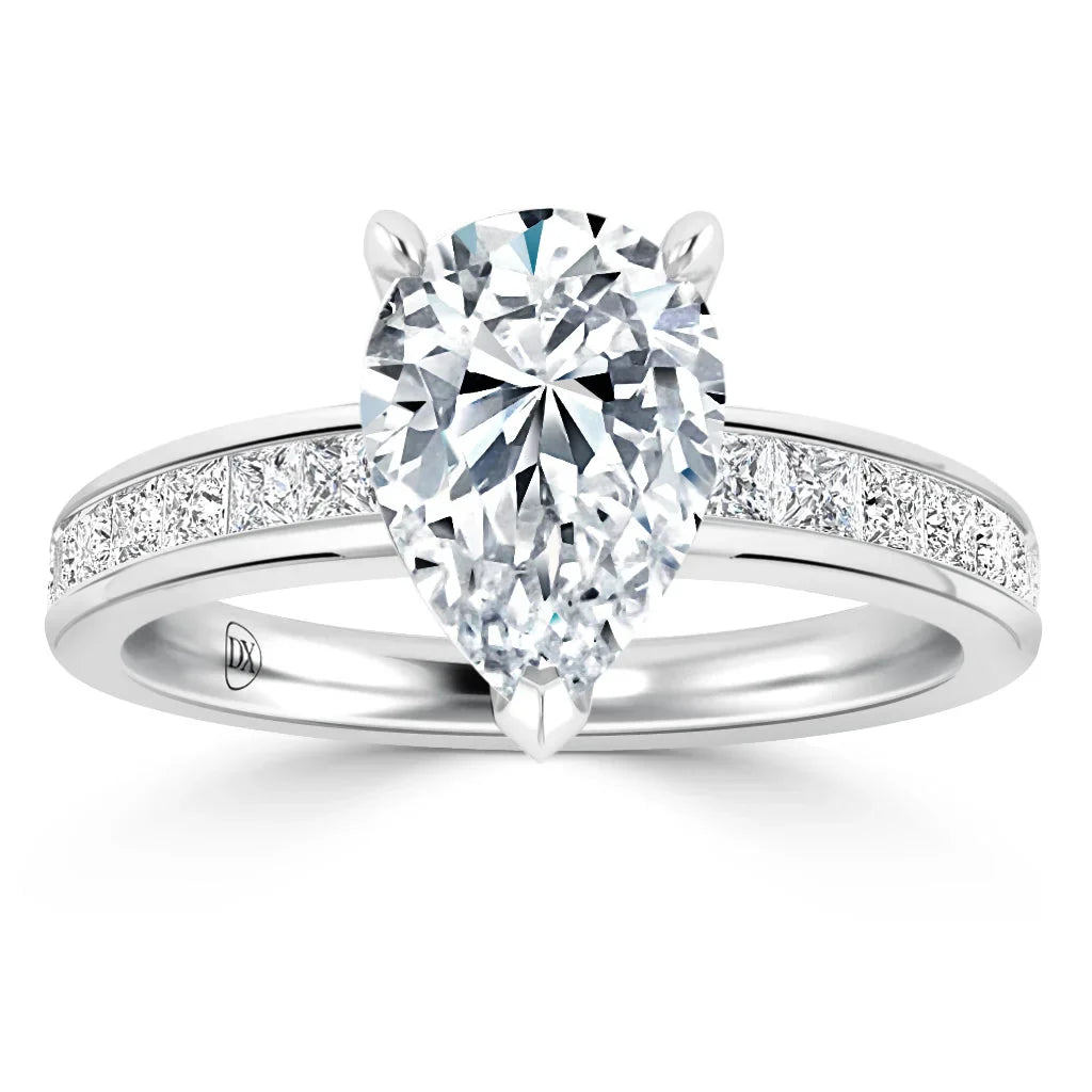 A pear-shaped diamond ring with a channel-set band featuring small square diamonds on a white metal band.