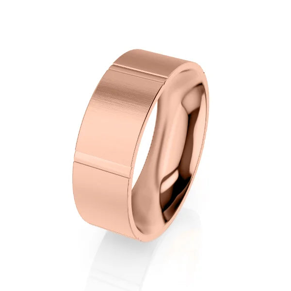 A wide, polished rose gold ring with a matte central band and a subtle groove near one edge.