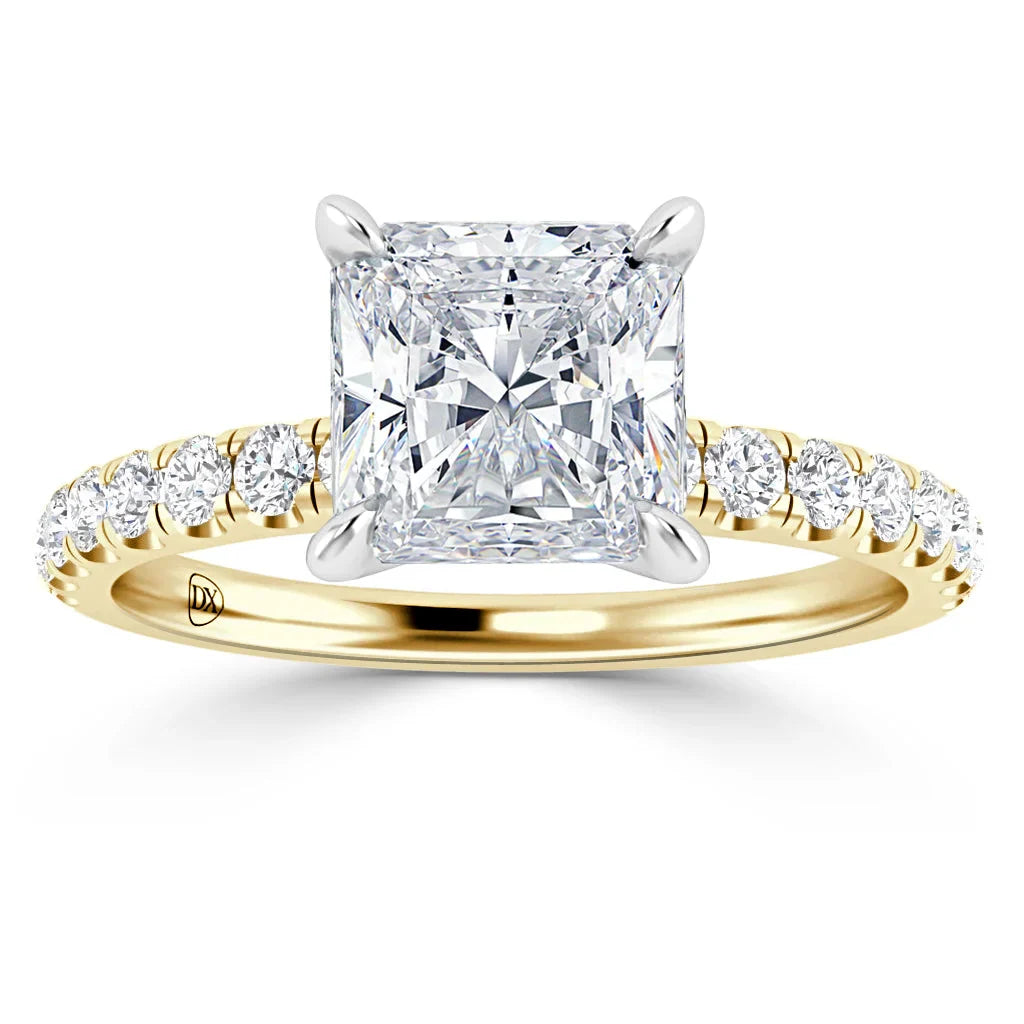 Gold ring with a large square diamond center and smaller diamonds set along the band, viewed from the front.