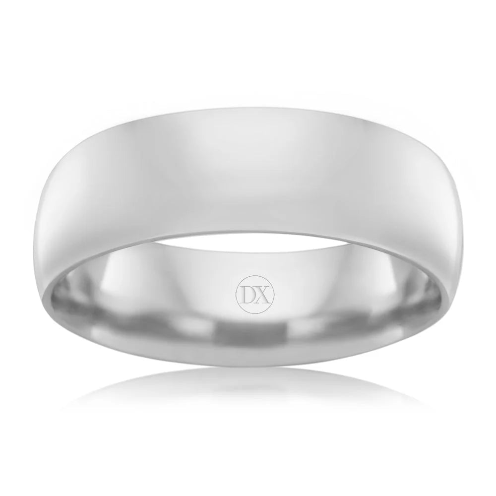 A plain, polished silver band ring with a subtle DX engraved on the inner surface.