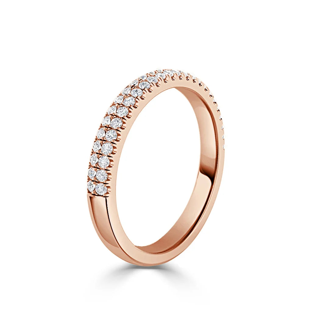 Rose gold ring with two rows of small round diamonds set along the band against a white background.