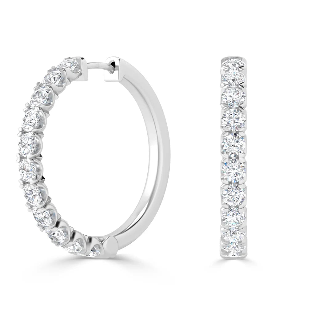 White gold hoop earrings adorned with round-cut diamonds, shown from the side and front views.