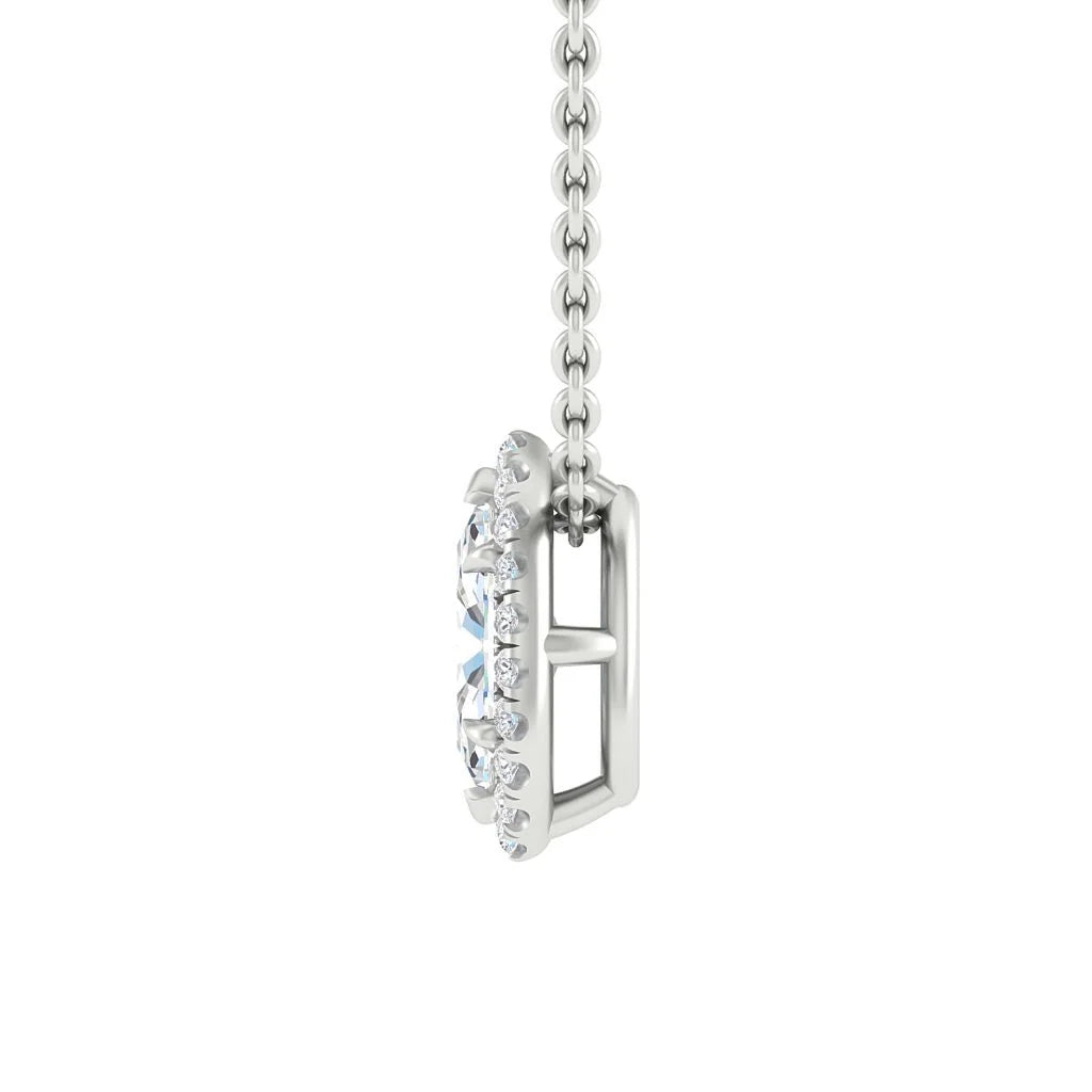 Side view of a silver necklace pendant with a large central gemstone surrounded by smaller clear stones.