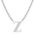 Silver chain necklace with a “Z” pendant, partly encrusted with small clear gemstones, on a white background.