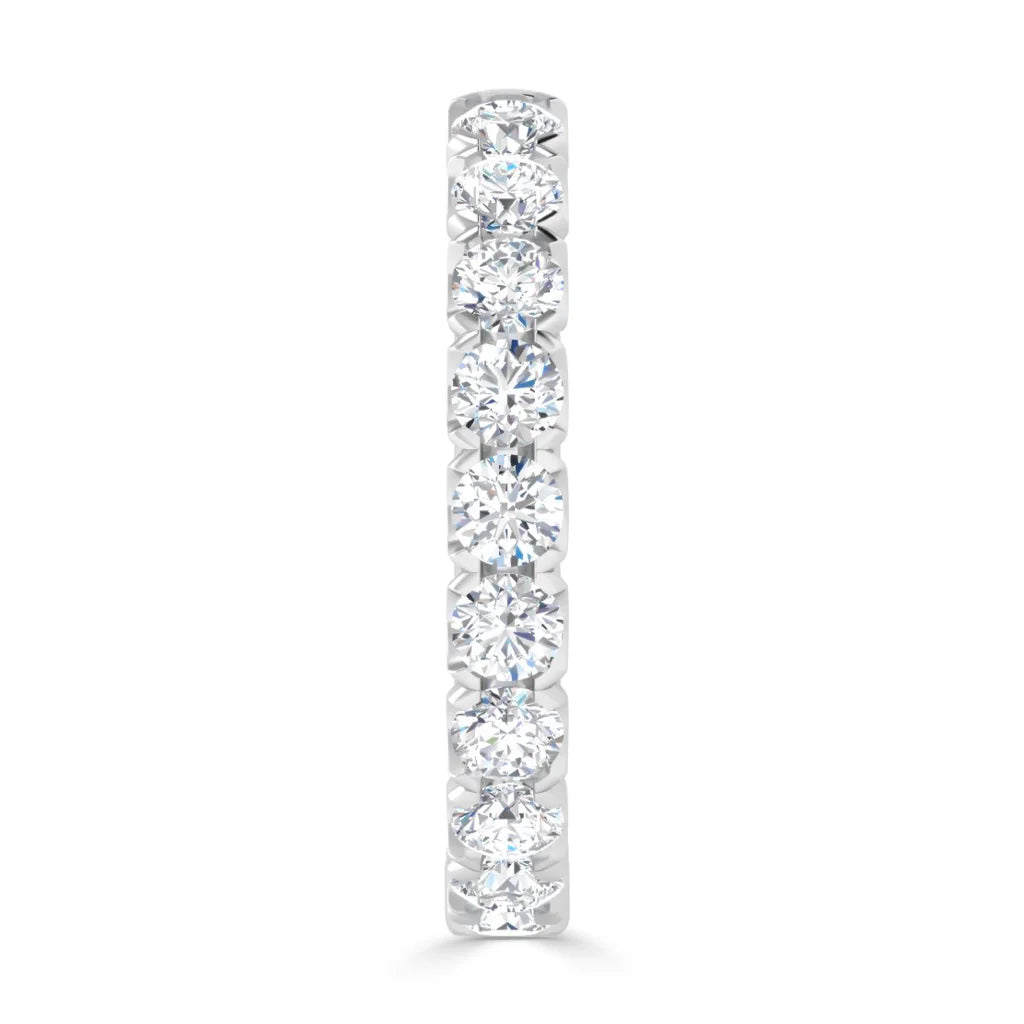 Front view of a white gold ring set with a vertical row of eight round diamonds.