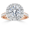 A rose gold ring with a large round diamond center, surrounded by a halo of smaller diamonds.