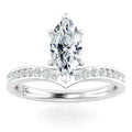 White gold ring with a marquise-cut diamond center and small round diamonds on the band.