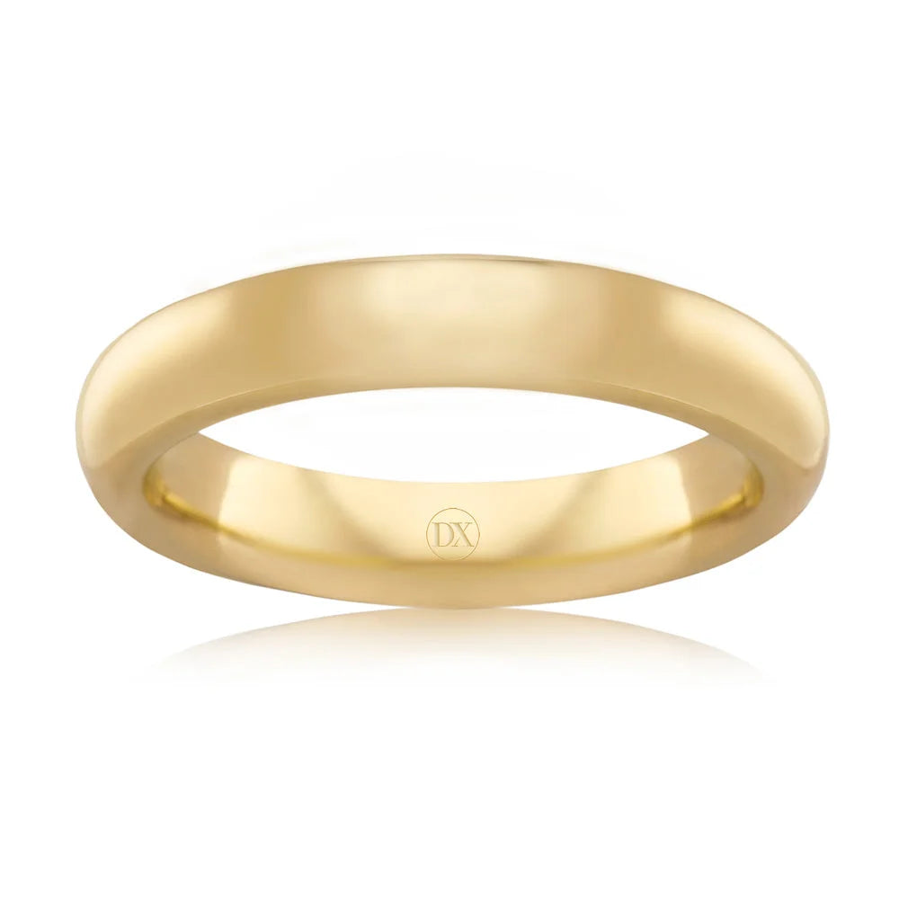 A simple, polished yellow gold band ring with a smooth finish and a small DX engraving inside.